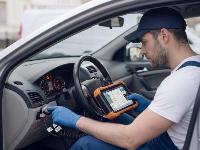 ABS Light Diagnostics Birmingham – auto electrician diagnosing an ABS warning light with a diagnostic tool for Birmingham Auto Electrics.