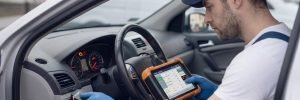ABS Light Diagnostics Birmingham – auto electrician diagnosing an ABS warning light with a diagnostic tool for Birmingham Auto Electrics.