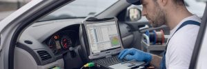 ECU Coding and Programming Birmingham – auto electrician programming an ECU with a laptop for Birmingham Auto Electrics.