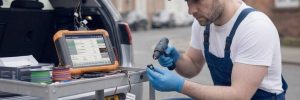 Parking Sensors Fitted Birmingham – auto electrician fitting parking sensors on a bumper for Birmingham Auto Electrics.